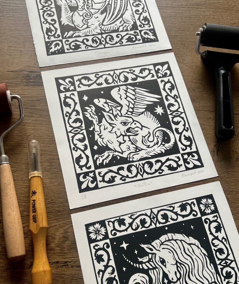 Medieval heraldic fantasy linocut prints of a dragon, griffin and a unicorn
